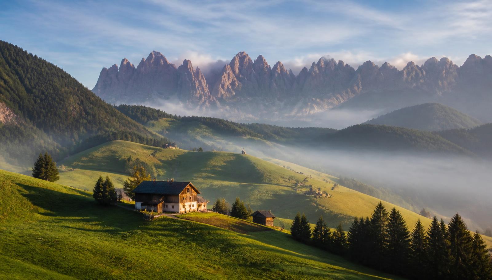 Farmhouses on alpine meadows in South Tyrol